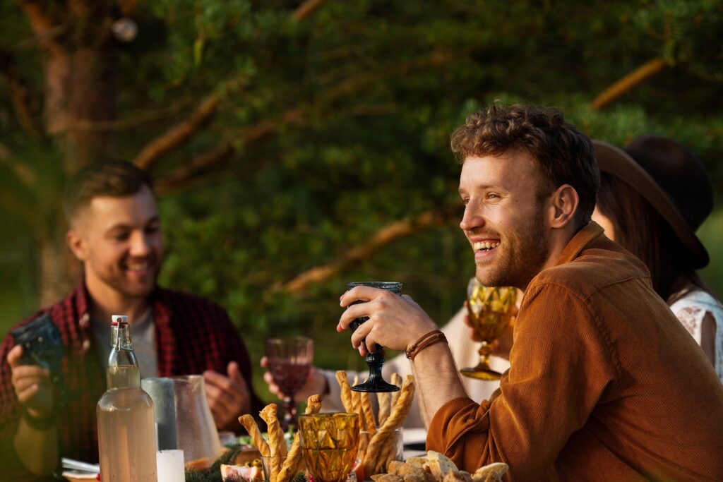 Friends laughing and enjoying a meal together at a restaurant in Barcelona