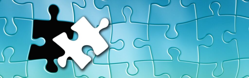 A nearly completed puzzle with one final piece hovering above it, symbolizing the final step of cultural integration and moving beyond the stereotypes about Spain to truly fit in.